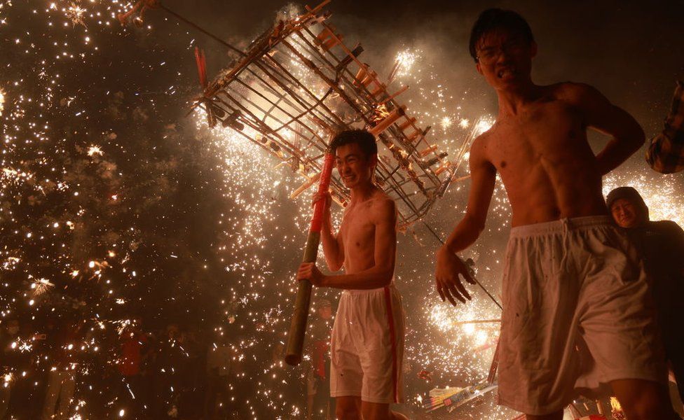 Dancers perform the Puzhai fire dragon dance in Meizhou, Guangdong Province, China