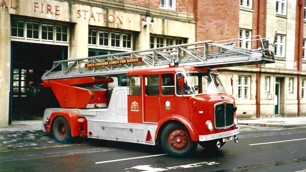 A fire engine leaves a station