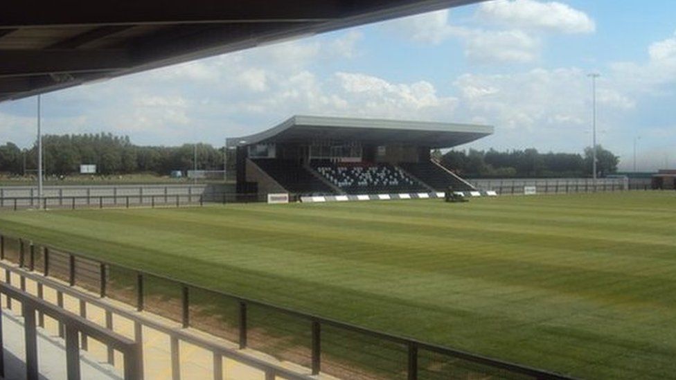 The Steel Park football stadium with stands around the edge of the pitch