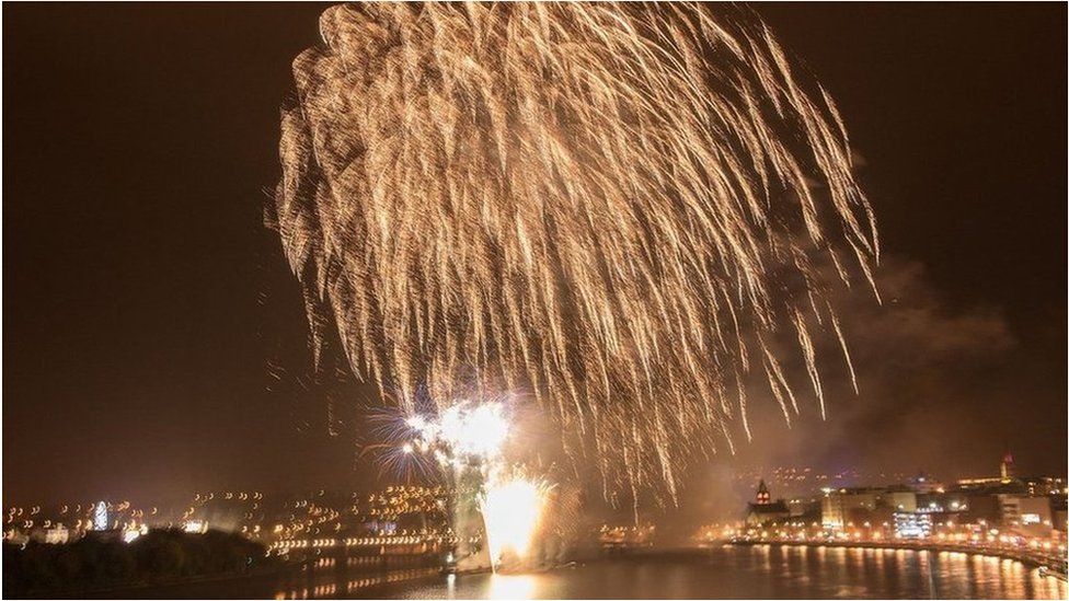 Crowds lined the city's quay to watch the fireworks display