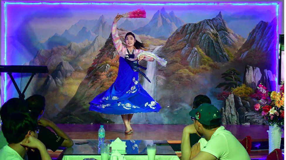 A traditional dancer performs for patrons at the Pyongyang Okryu-gwan, a North Korean restaurant in Dubai, 21 September 2017