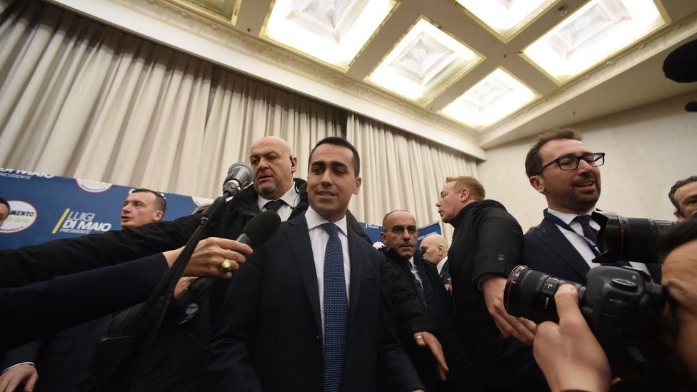 Italy"s populist Five Star Movement (M5S) party leader Luigi Di Maio (C), arrives to give a press conference a day after Italy"s general elections, on March 5, 2018 in Rome