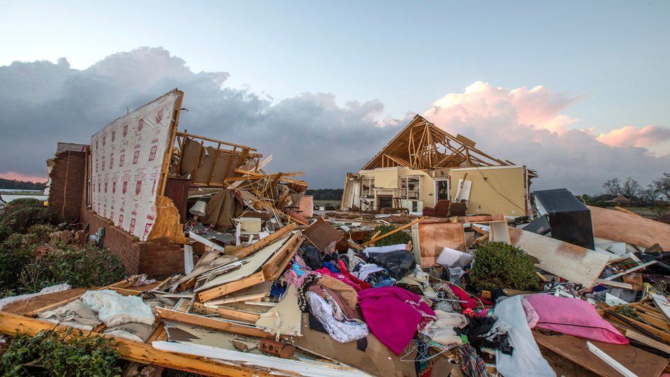 A house that was cut in half by a tornado near were seven people were killed outside Adel, Georgia