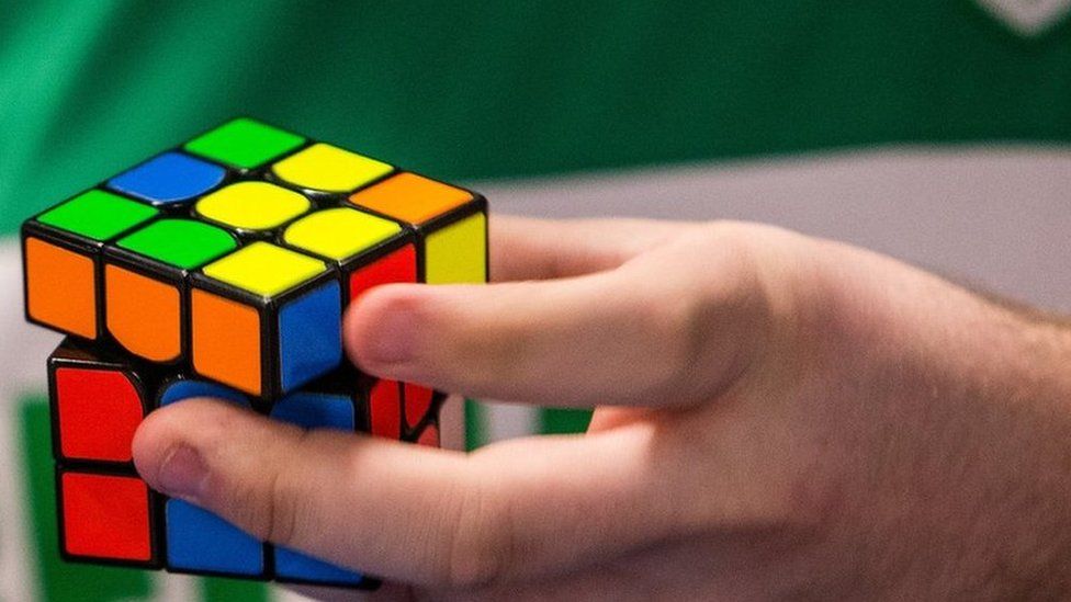 Competitor holds Rubik's Cube in competition in Texas in 2017