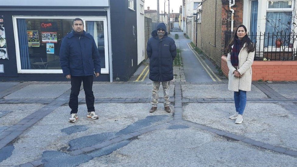 William Fernandes, Darryl Vas and councillor Adorabelle Shaikh near Manchester Road
