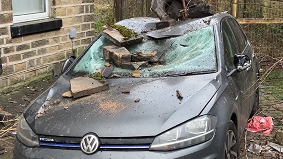 Damaged car with broken windscreen