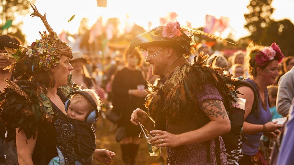 A couple at a festival sunset
