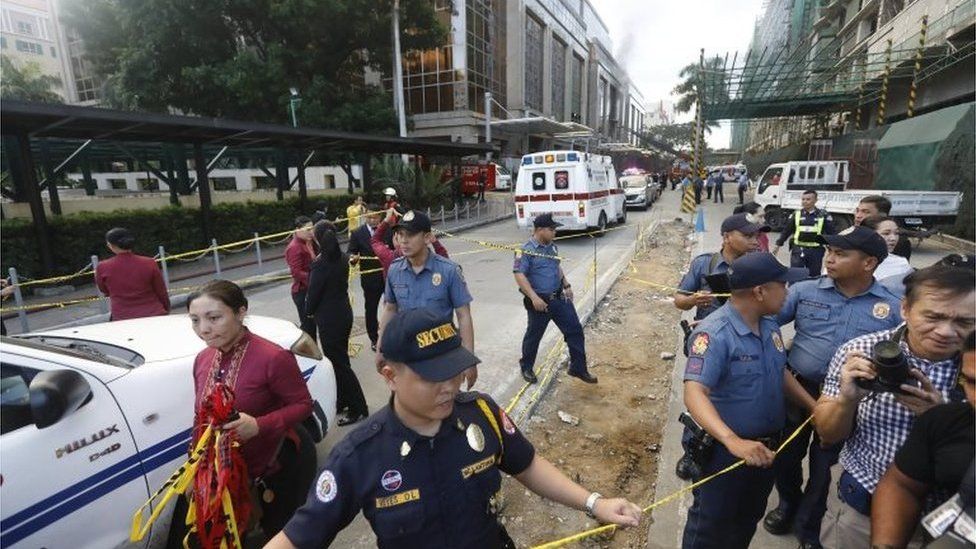 Philippines police and private security secure the vicinity of the Resorts World Manila hotel and casino complex in Pasay City, south of Manila, Philippines 2 June 2017.