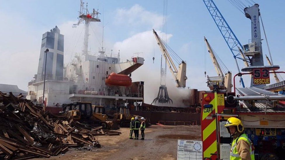 Crews tackle fire on board cargo ship in Southampton - BBC News