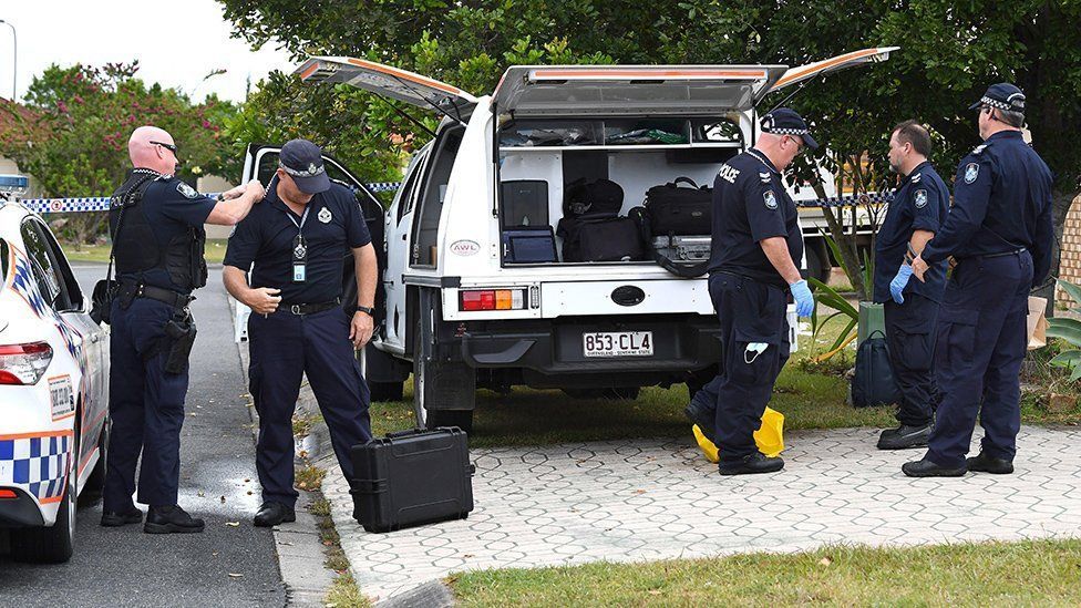 Police are seen at the scene of a fatal stabbing at a Whitfield Crescent in the suburb of North Lakes, near Brisbane