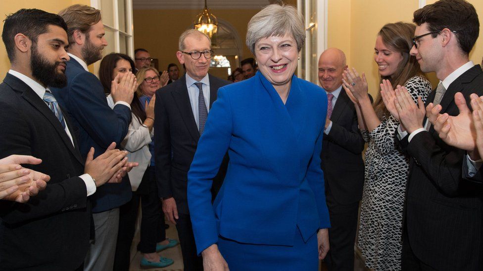 Theresa May arrives back in Downing Street after forming a government