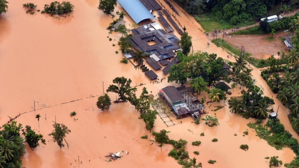 An aerial shot shows flood water surrounding houses in Sri Lanka