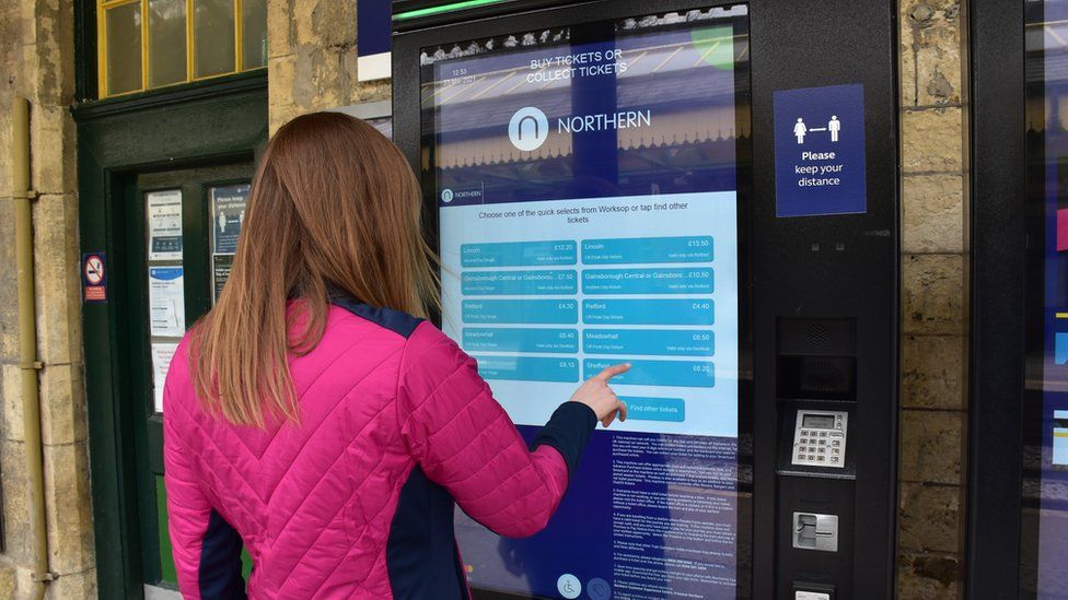 Woman at Northern ticket machine