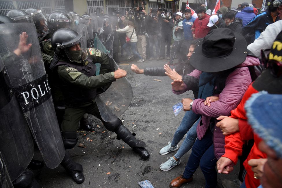Teachers clash with police officers during a protest against a new curriculum set by Bolivia's Ministry of Education, in La Paz, Bolivia. March 21, 2023.