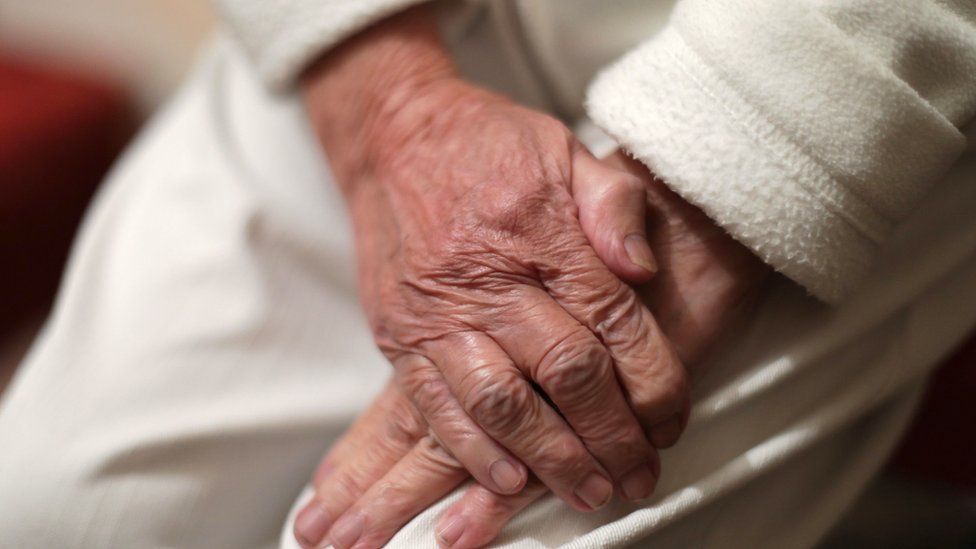 An elderly woman's hands