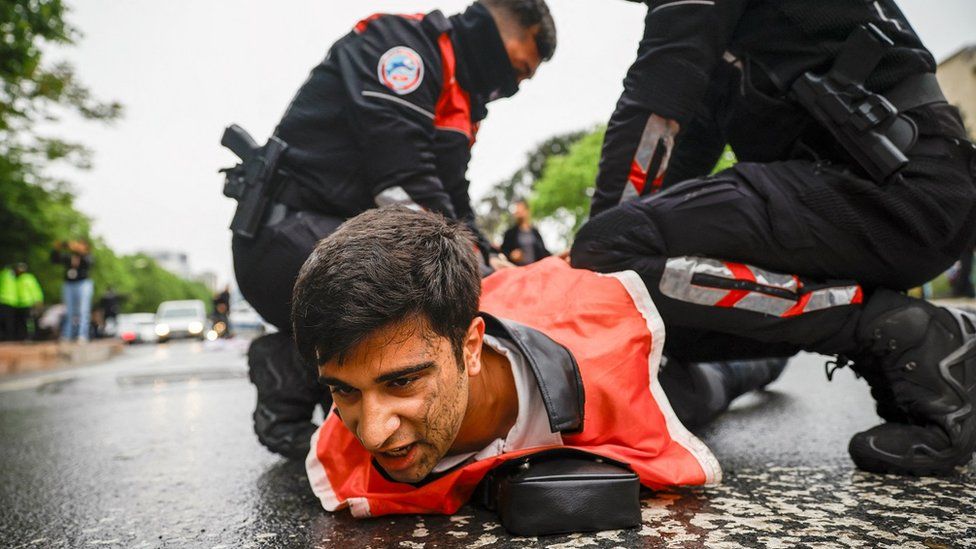 Turkish police detain a protester as he and others attempt to march to Taksim Square in Istanbul during a May Day rally marking International Workers' Day.