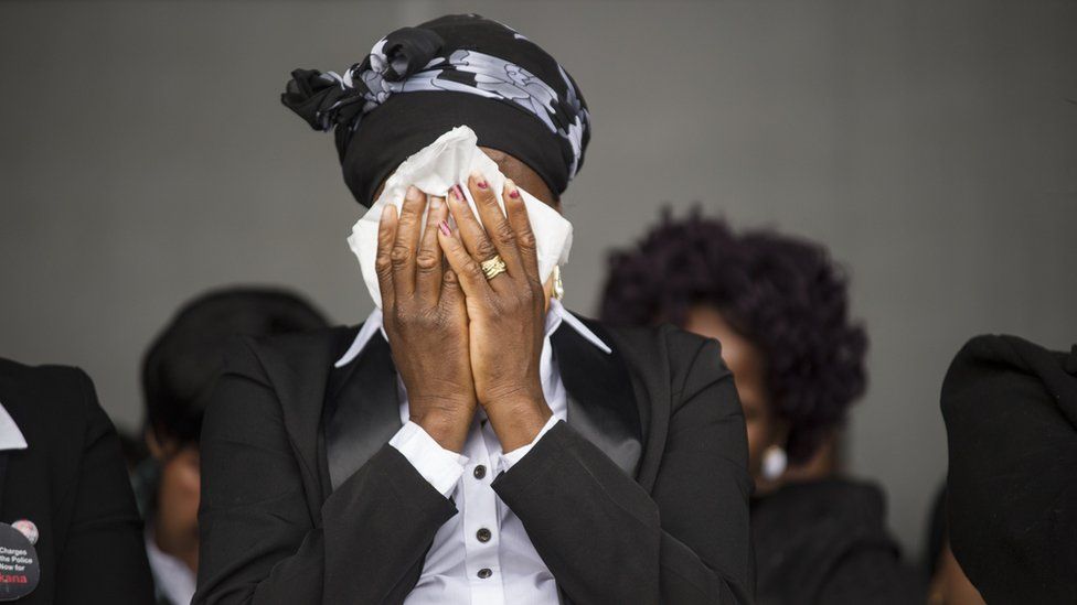 A widow cries on August 16, 2014, in Marikana, during a ceremony in tribute to miners who where gunned down by the South African police during a violent wave of strikes two years ago