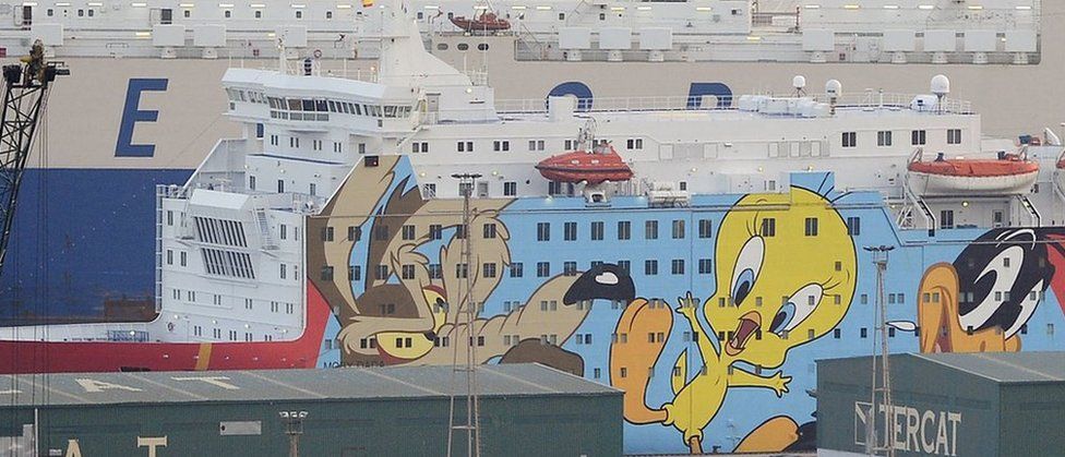 A ship, decorated with "Looney Toons" characters is moored in Barcelona to house police reinforcements on September 21, 2017