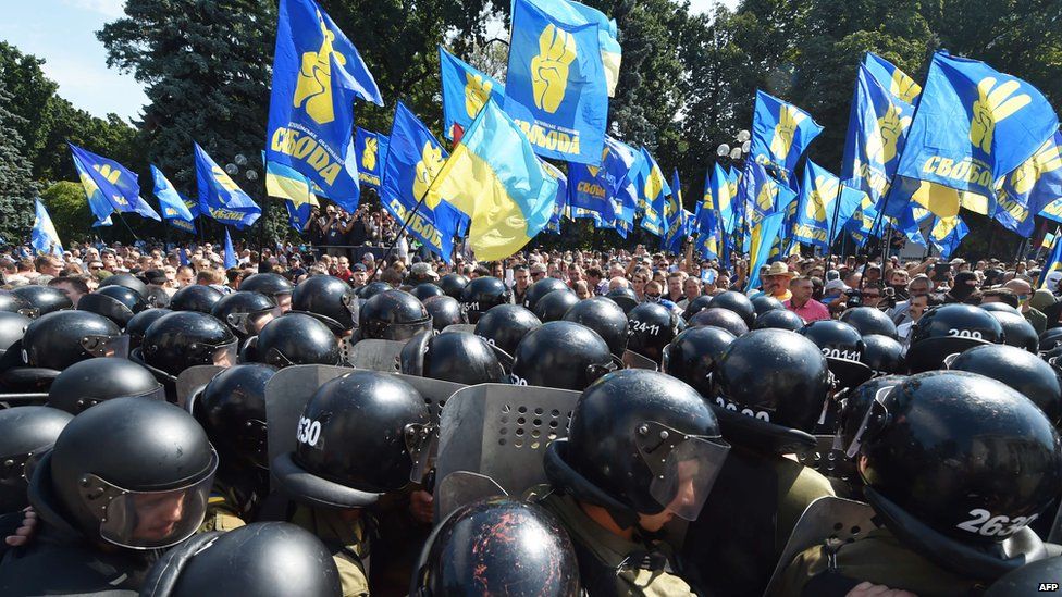 Flag-waving protesters face off against Ukrainian police