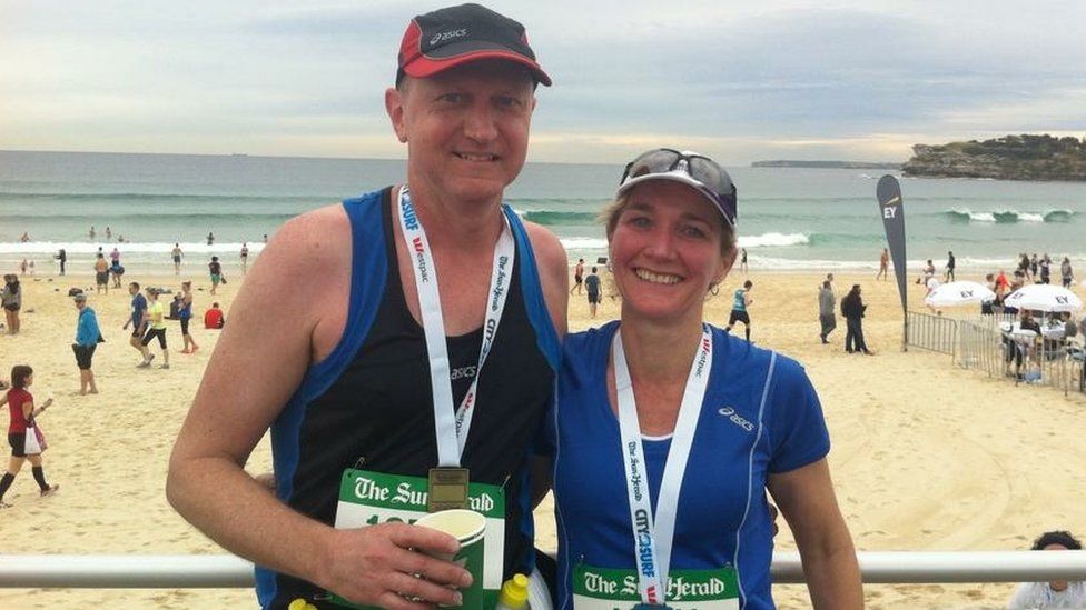 Peter and Lisa Bayliss at a beach following a run in Sydney