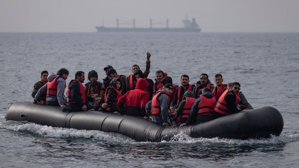 An inflatable craft carrying migrants across the Channel in August