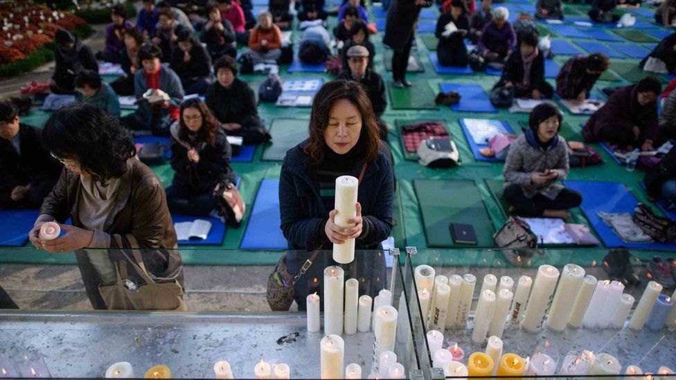 Parents pray for their children's success at a temple in Seoul