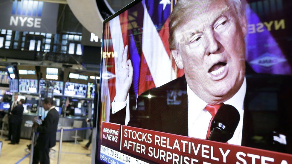 Donald Trump on a trading floor TV screen