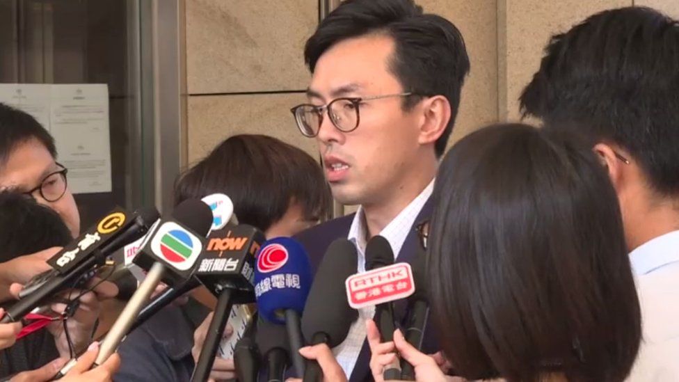Avery Ng Man-yuen speaking outside West Kowloon Law Courts