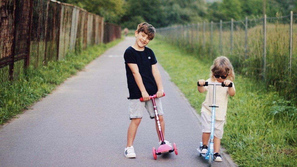 children using scooters