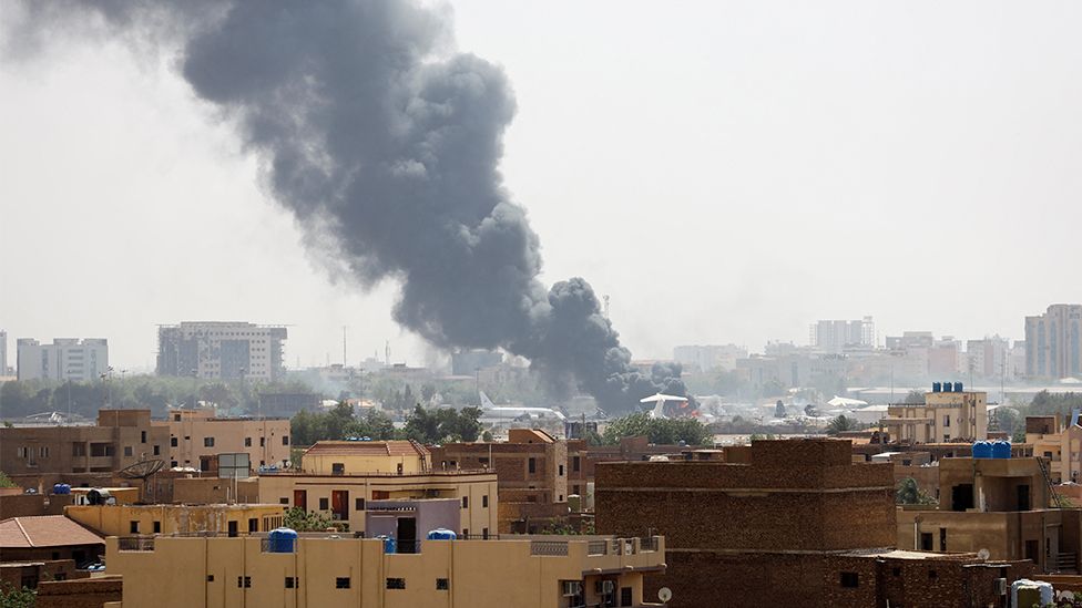 Smoke rising on the horizon, Khartoum