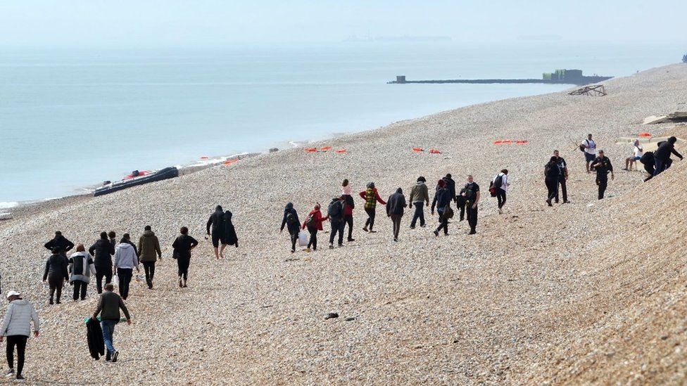 Migrants on the beach
