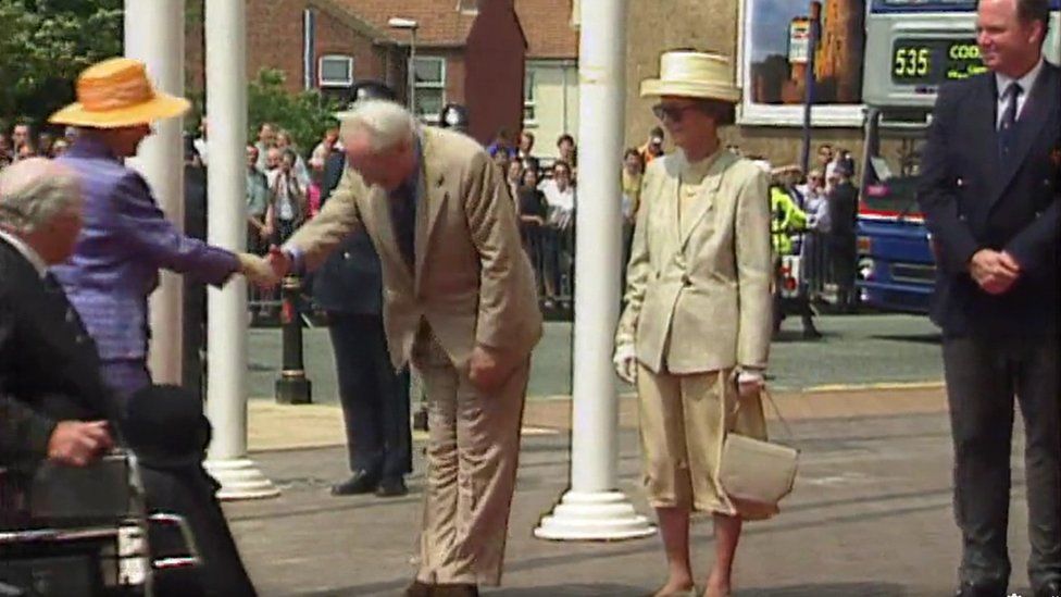 Billy Wright shaking hands with the Queen in Wolverhampton