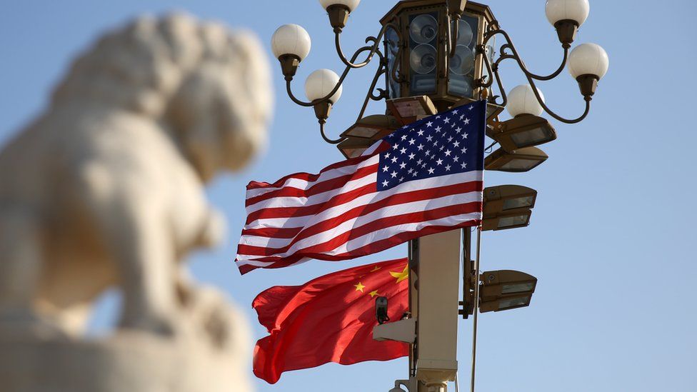 Chinese and American national flags fly on Tiananmen Square