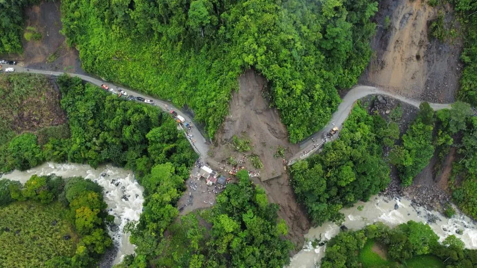 Part of the mountainside gave way and buried at least three vehicles