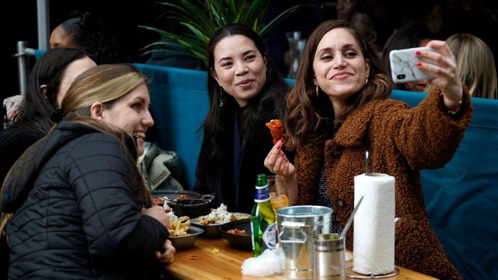 A group of friends enjoying a meal