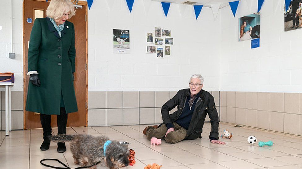 Then-Duchess of Cornwall with Paul O'Grady on floor
