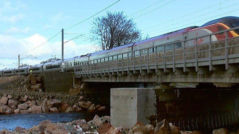 Train going over mended viaduct