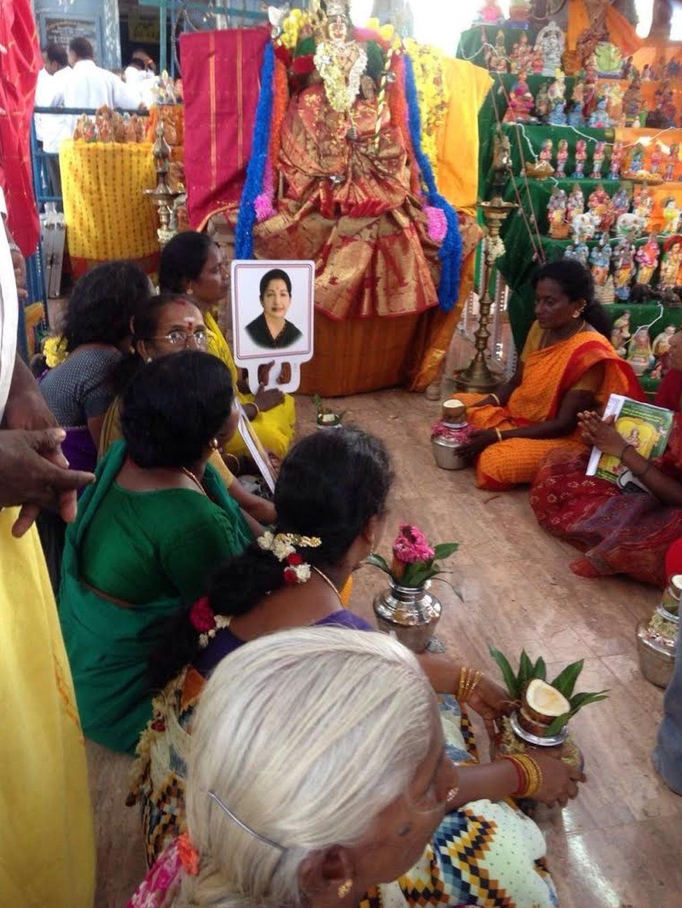 Women praying for Jayalalitha