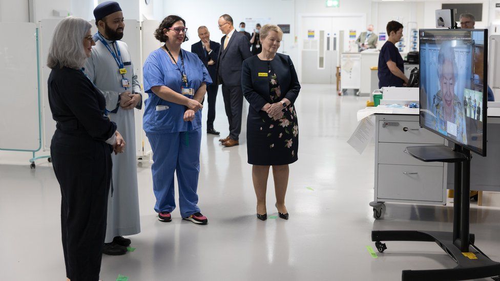 Hospital staff talk to the Queen during a video call