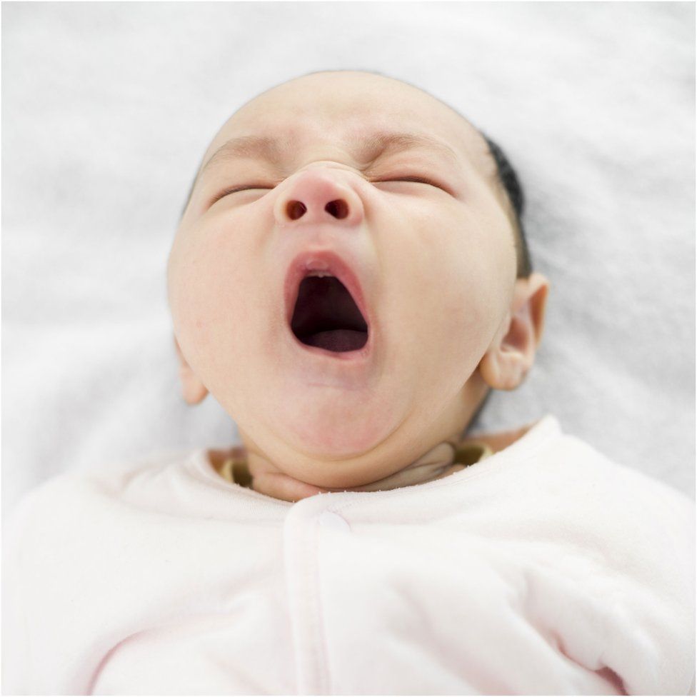 A baby yawning