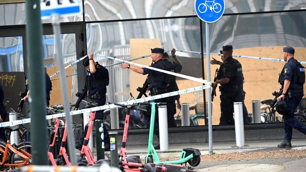 Members of the police work at the scene of a shooting at Emporia Shopping Center in Malmo, Sweden, August 19, 2022