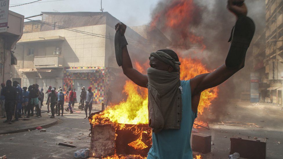 Opposition supporters of leader Ousmane Sonko clash with security forces during a protest in Dakar, Senegal 5 March 2021