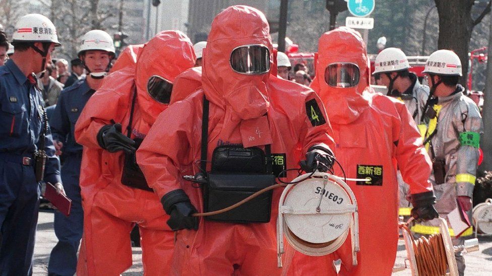 Police in hazmat suits at the site of the 1995 attack
