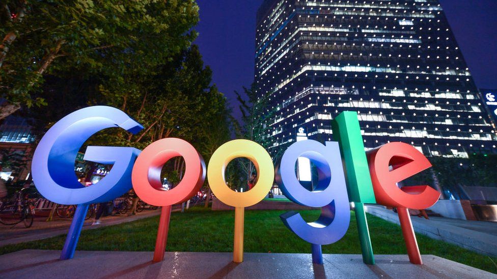 The Google Inc. logo is illuminated in front of Google Beijing Office