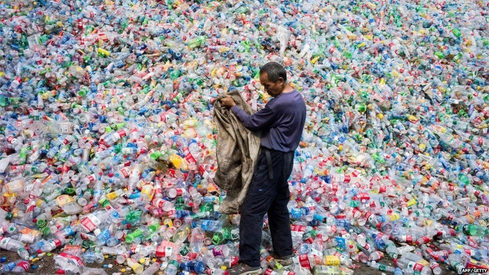 Chinese labourer sorting out plastic bottles for recycling in Dong Xiao Kou village, on the outskirt of Beijing