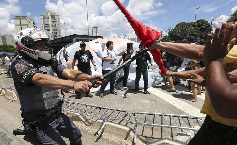 Demonstrators clash with police