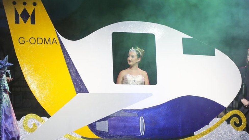 A performance of the pantomime Cinderella featuring a Monarch plane instead of Cinderella's carriage