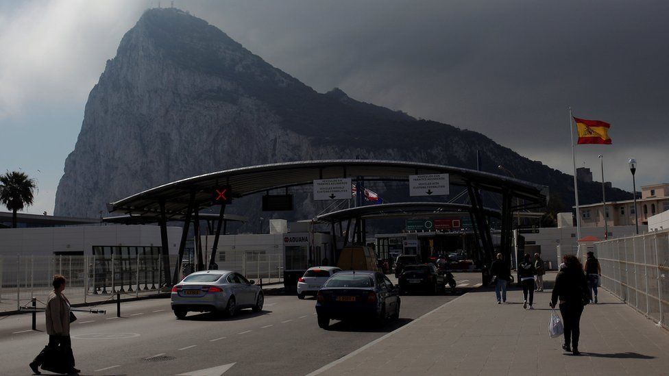 People enter Gibraltar at its border with Spain