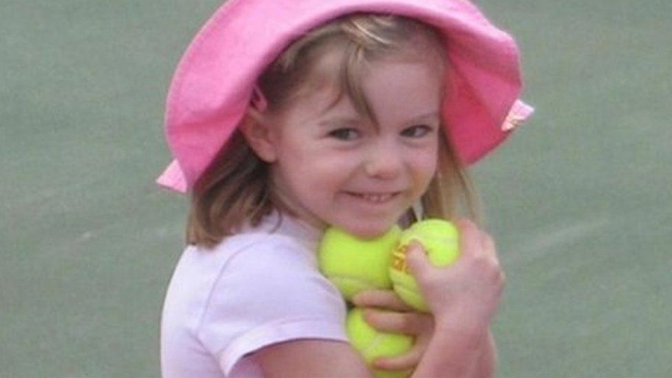 Madeleine McCann, holding several tennis balls, shortly before her disappearance