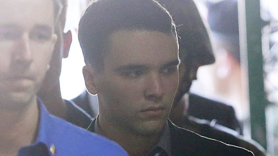 U.S. Marine Lance Corporal Joseph Scott Pemberton (R) is escorted into a court in Olongapo city, north of Manila December 1, 2015